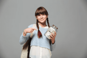 student with a jar of money