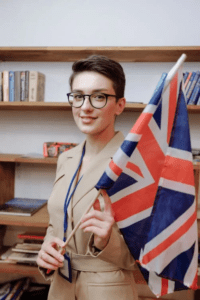 A woman holding a UK flag